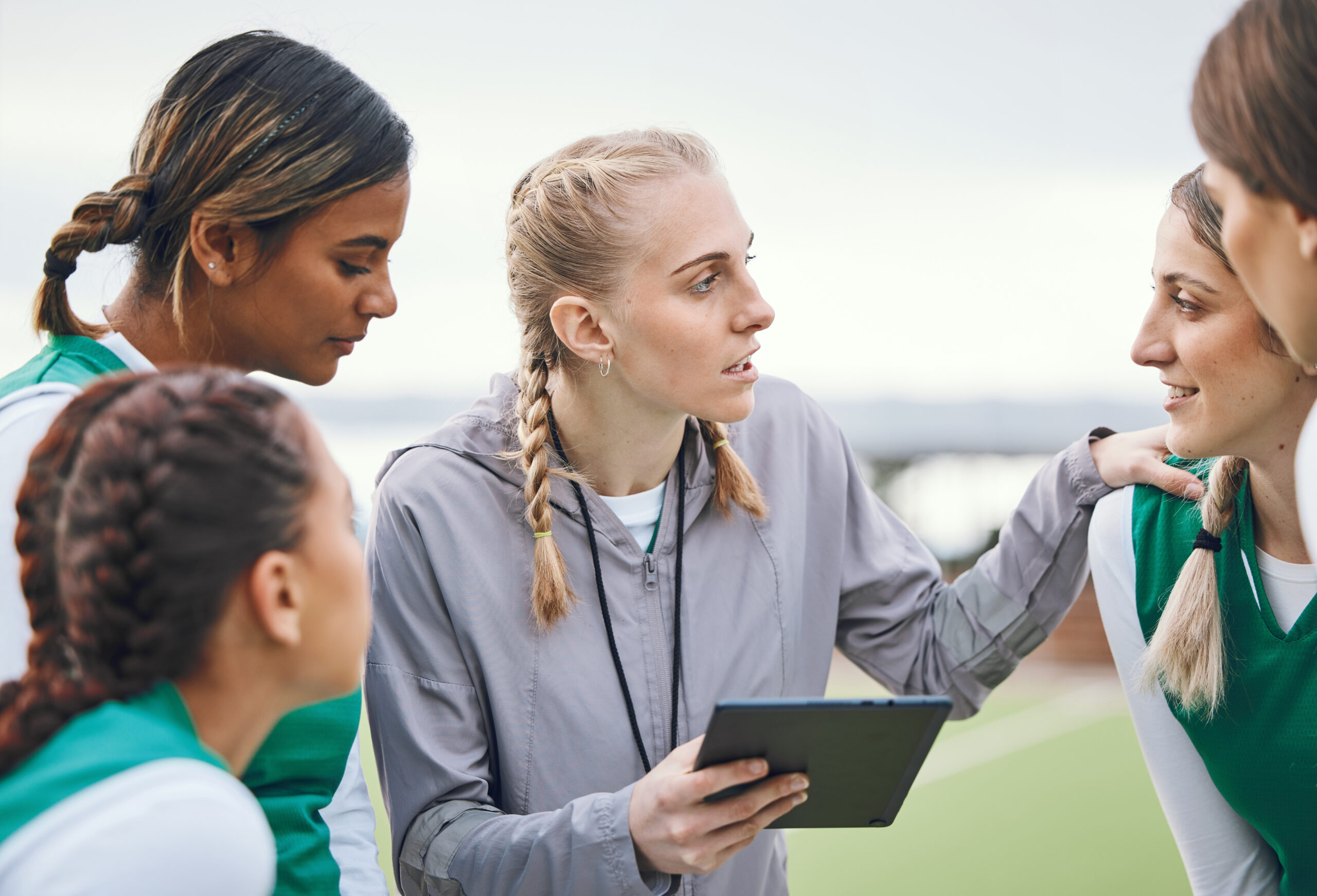 Coach, sports women or team planning tactics or strategy in a hockey training game, conversation or.